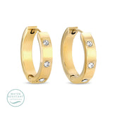 Contemporary huggies w/3 single cubic zirconia