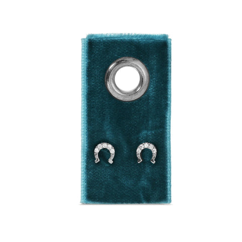 Silver pave horseshoe earring on velvet tag